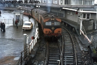 This 1979 scene from Carlisle Pier shows re-engined C Class Metrovick loco No.232 pulling out of the pier station with a couple of parcel vans bound for Pearse Station, Dublin. ©Jonathan M.Allen